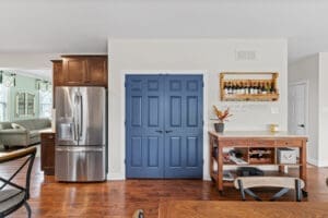 Professionally painted kitchen with blue pantry doors